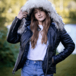 Larissa's Black Leather Jacket with Hoodie and Fur Trim - Image 4